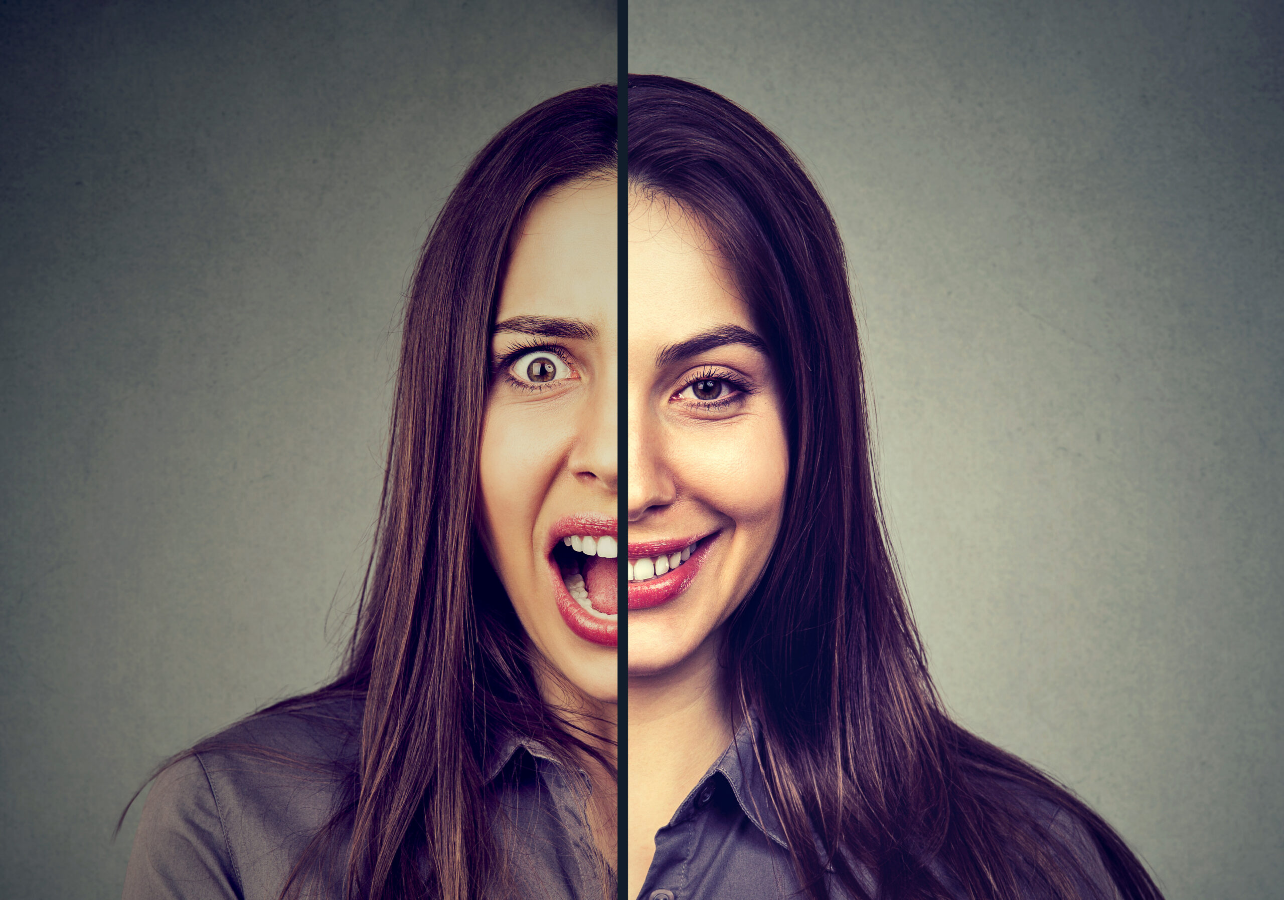 Bipolar disorder and split personality concept. Woman with double face expression isolated on gray background