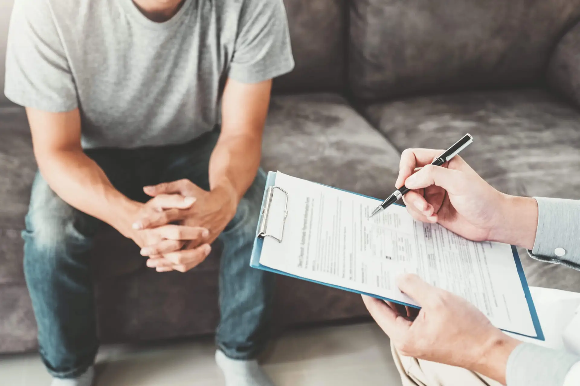 Doctor consulting and diagnostic examining with men's patient health disease and writing on prescription record information document visit patient's home