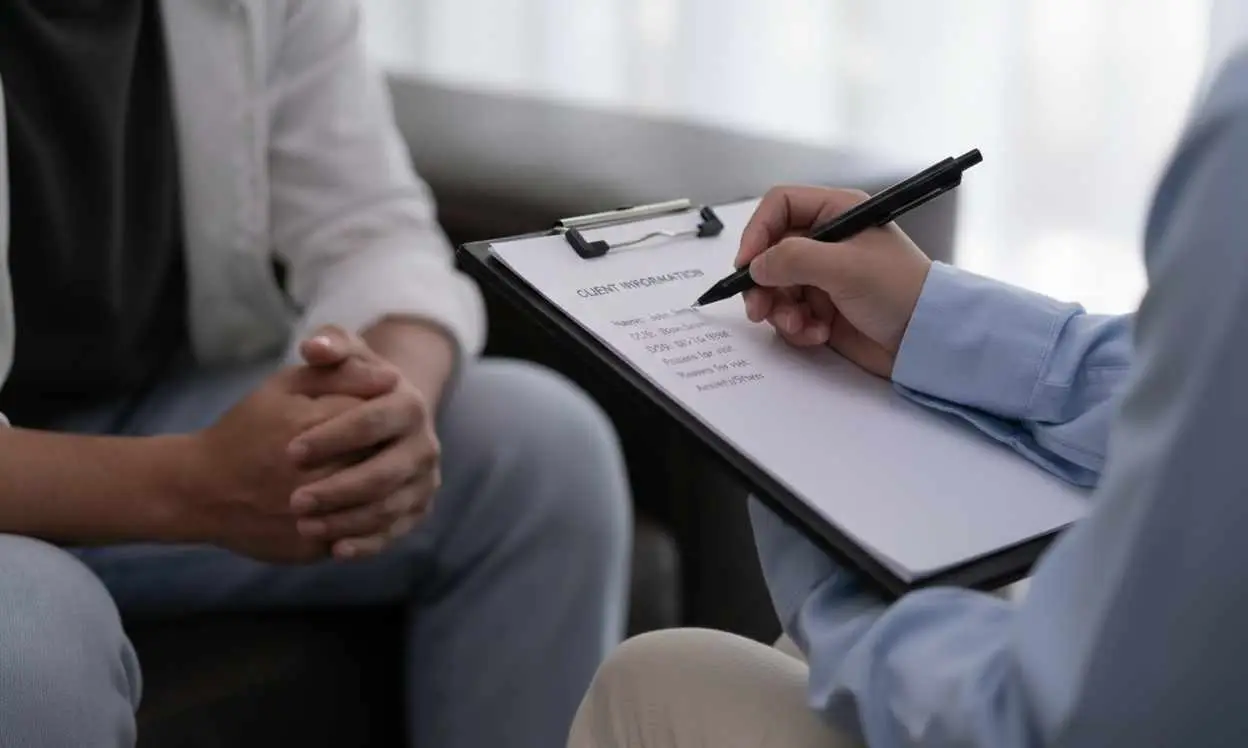 Las Vegas Psychiatrist at MindWell writing client information.