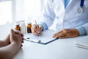 Doctor Prescribing medication to a Patient