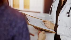 Doctor holding a clip board