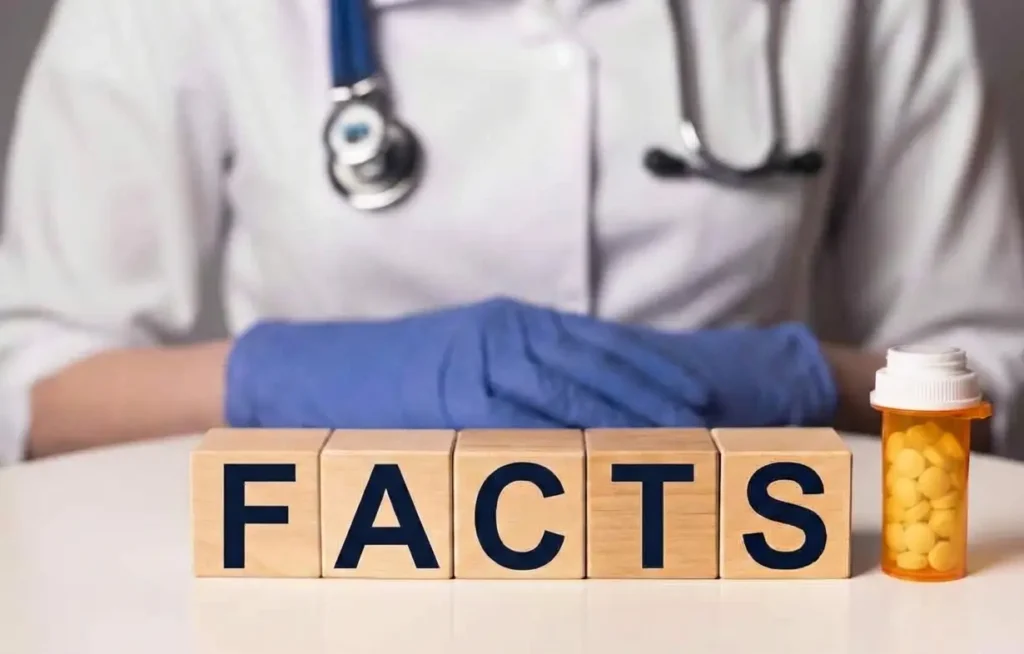 Doctor with his hand crossed on top of a table