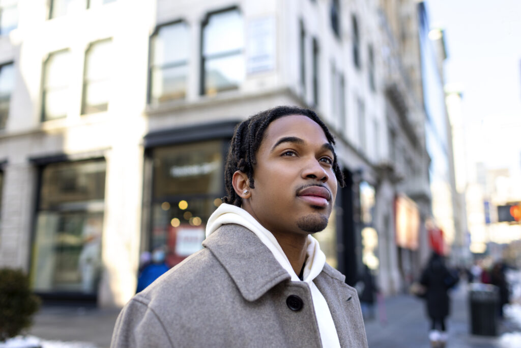 Man with ADHD symptoms looking around city of Las Vegas unable to focus from the lights and happenings so he is heading to a MindWell Psychiatrist