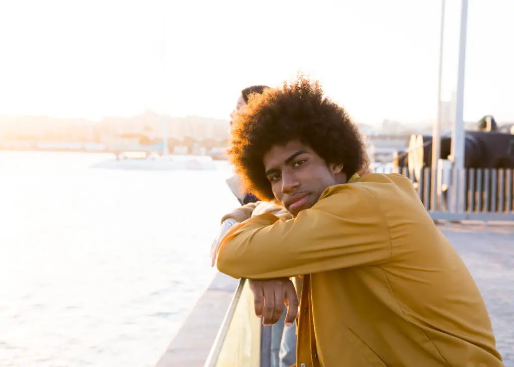 Man on bridge looking into camera while dealing with anxiety and getting treatment at MindWell Psychiatric services in Las Vegas