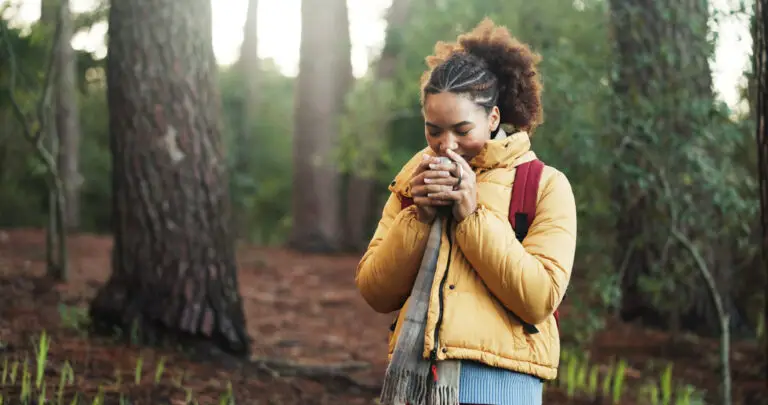 Woman in nature near Las Vegas smelling something in her hands and searching for same day psychiatrist at MindWell
