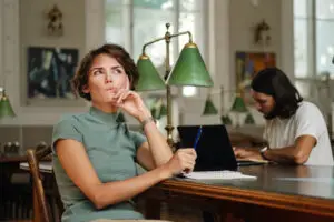 person wondering with person in background sitting at desk studying and person in fronts antidepressants stopped working