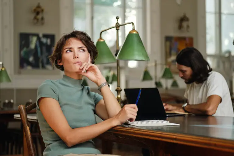 person wondering with person in background sitting at desk studying and person in fronts antidepressants stopped working