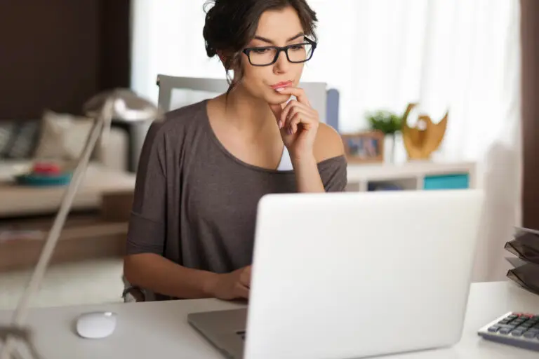 woman sitting at laptop searching cost for frat test in las vegas