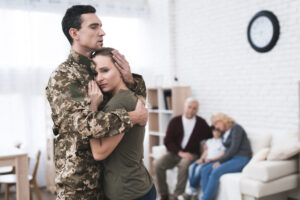 military husband hugging wife as she secretly hates being a military wife in las vegas
