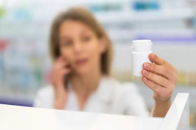 pharmacist in las vegas looking at bottle considering shortage of leucovorin