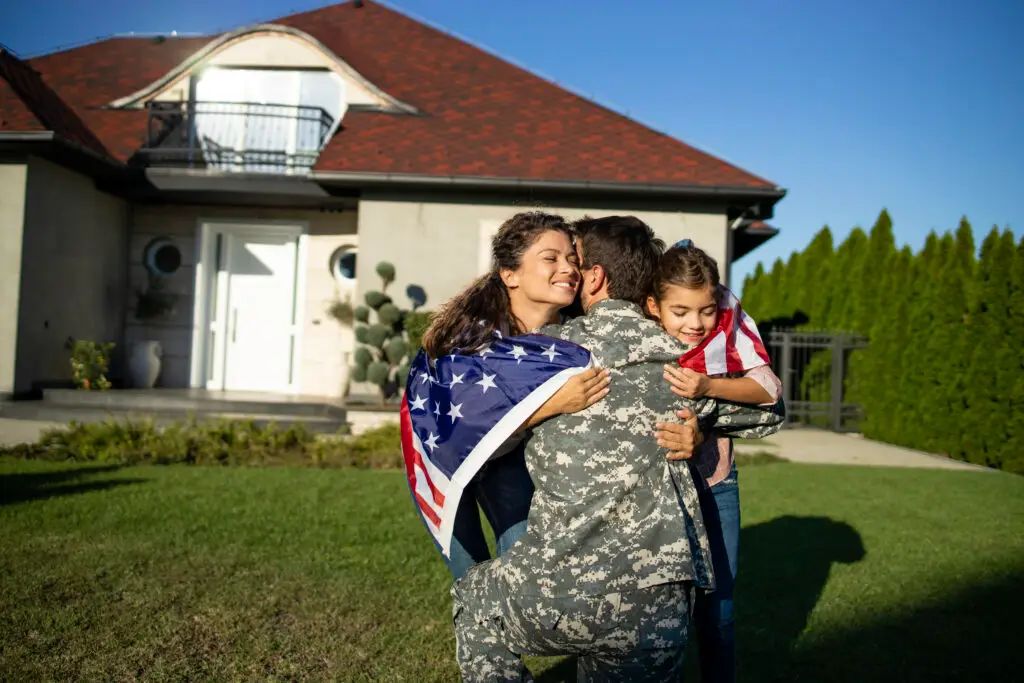 family hugging veteran returning home in las vegas needing military spouse mental health
