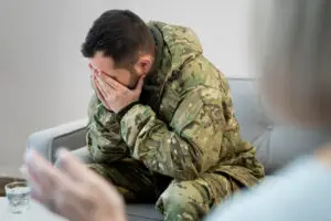 veteran with hands in palms talking to a after them saying their fine when they are not in las vegas