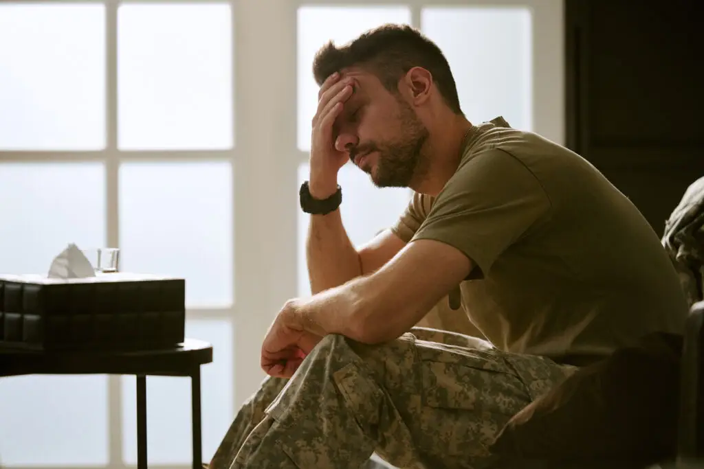 veteran sitting on couch with hand in palm dealing with moral injury in las vegas
