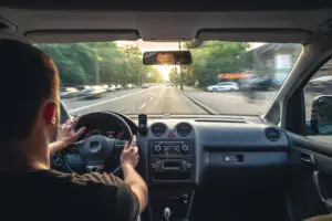 Person sitting in car driving through Las Vegas on way to mindwell psychiatric services for ptsd treatment after a car crash