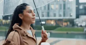 woman outside in the rain of las vegas wondering if her grief has turned into depression