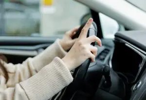 driver with fingers extended having panic attack in las vegas traffic needing to go to mindwell psychiatric services