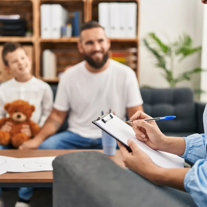 Happy father and son with psychiatrist providing wonderful treatment in Las Vegas at MindWell