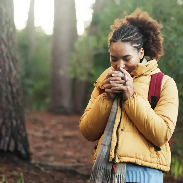 Woman in nature near Las Vegas smelling something in her hands and searching for same day psychiatrist at MindWell
