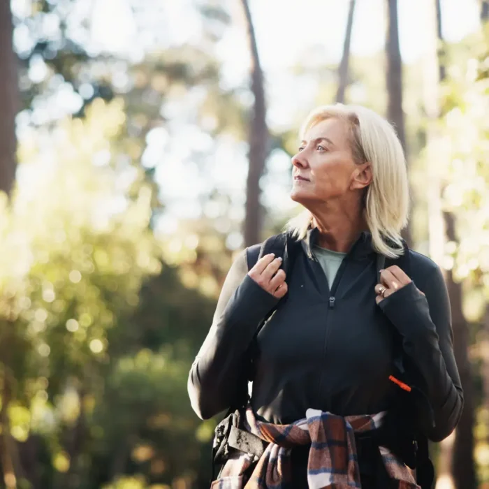 Woman with depression in forest near Las Vegas seeking psychiatric treatment from MindWell