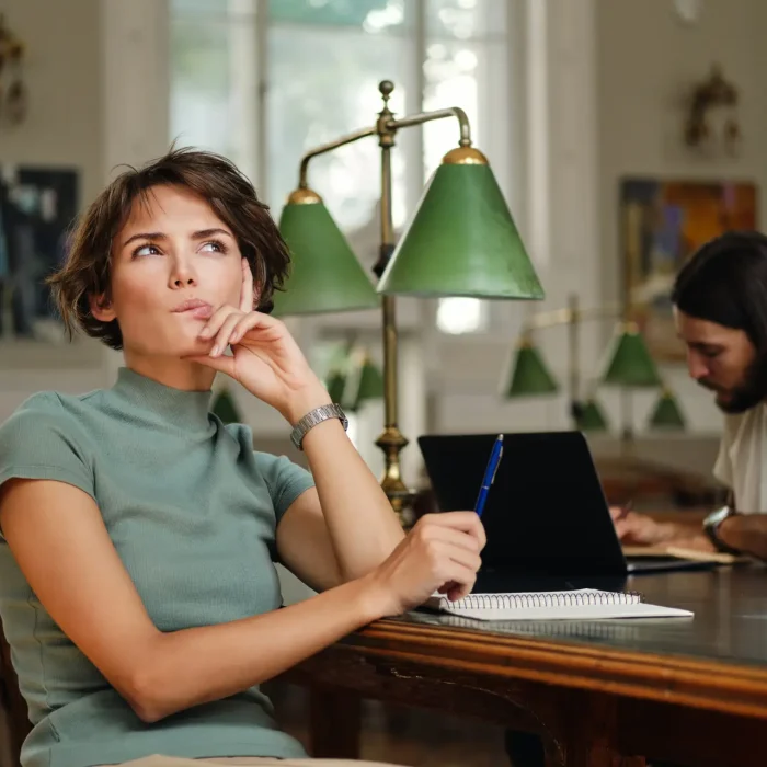 person wondering with person in background sitting at desk studying and person in fronts antidepressants stopped working