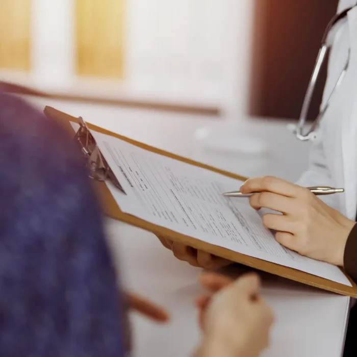 Doctor holding a clip board