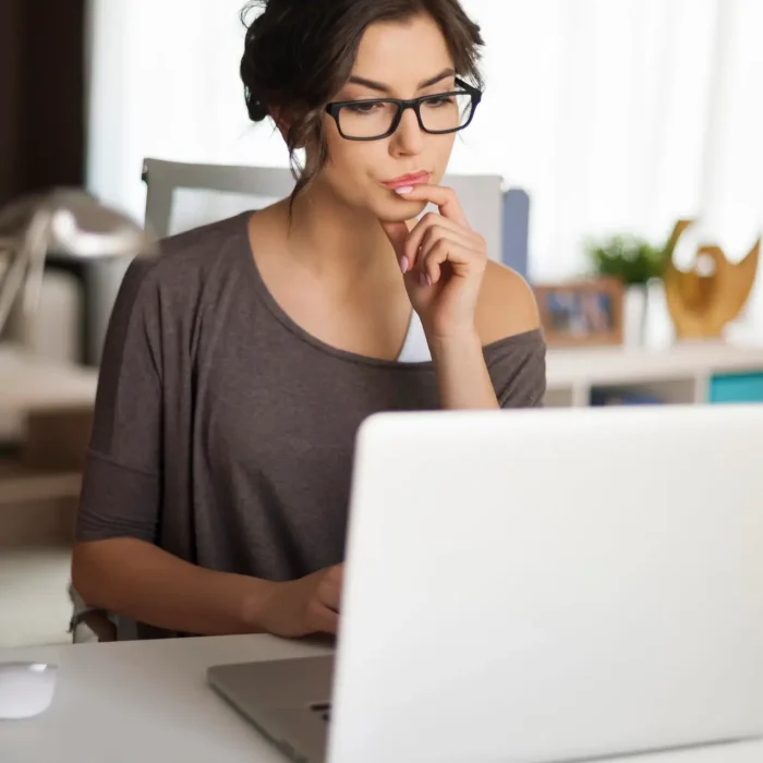 woman sitting at laptop searching cost for frat test in las vegas